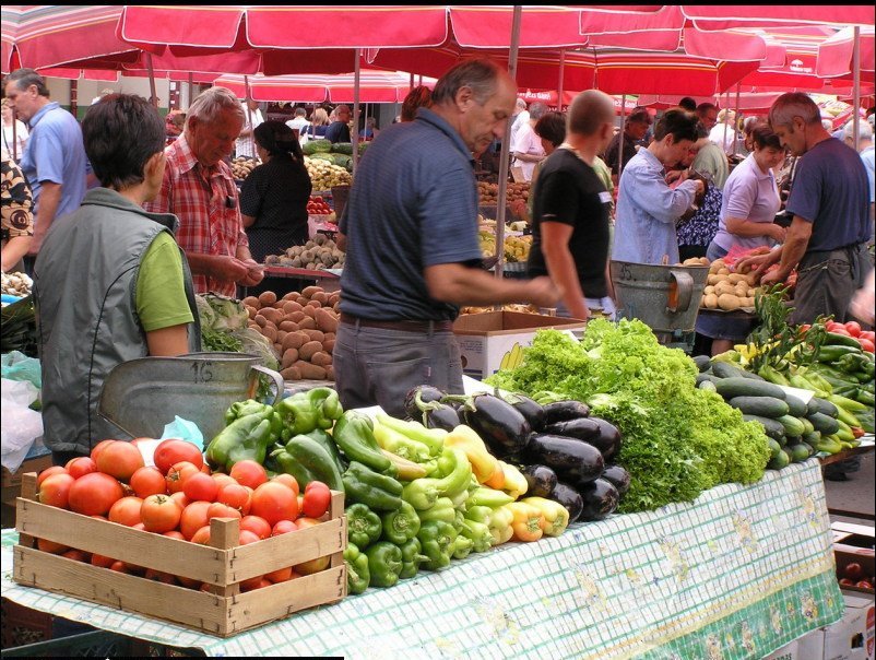 An outdoor market connects consumers with local producers.